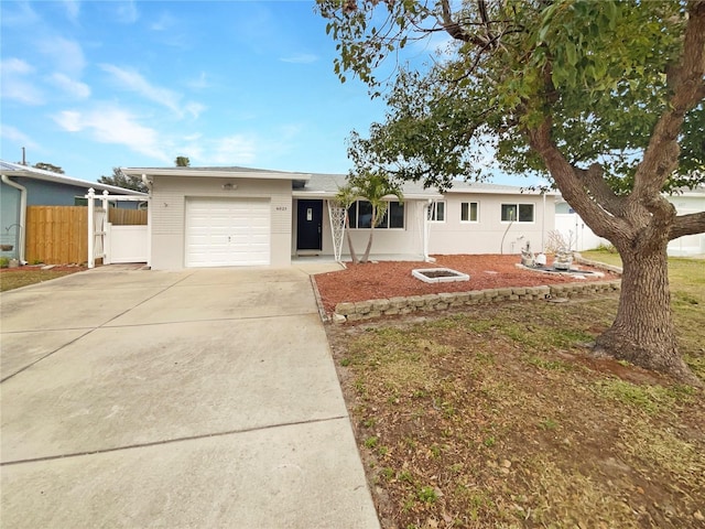 single story home featuring a garage