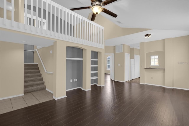 unfurnished living room with ceiling fan, lofted ceiling, and hardwood / wood-style floors