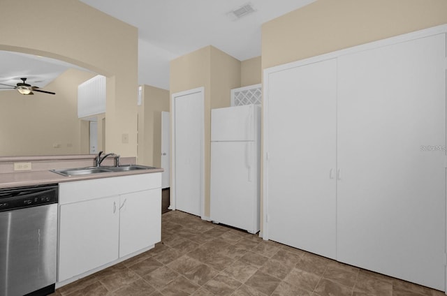 kitchen with ceiling fan, stainless steel dishwasher, sink, white cabinets, and white refrigerator