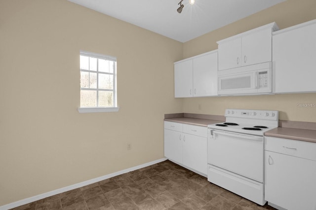 kitchen with white appliances and white cabinets