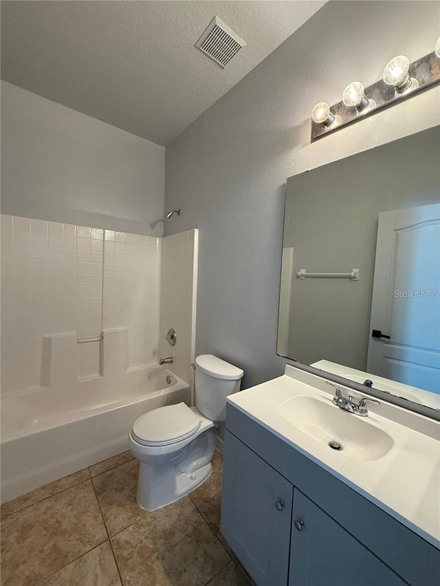 full bathroom featuring a textured ceiling, tile patterned floors, vanity, shower / bath combination, and toilet