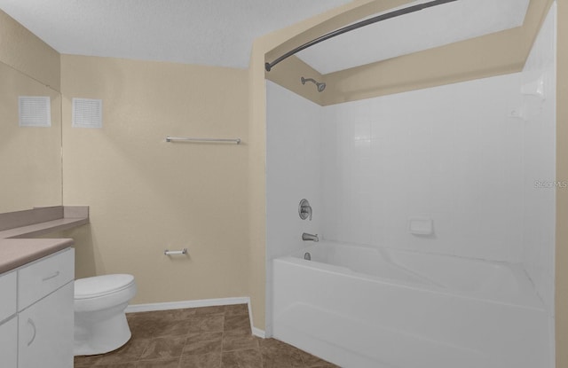 full bathroom featuring toilet, shower / bathing tub combination, tile patterned floors, a textured ceiling, and vanity