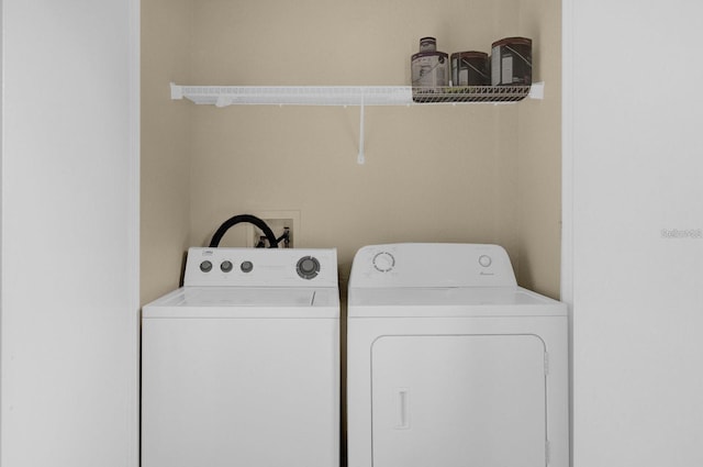 washroom with separate washer and dryer