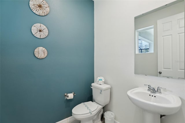 bathroom featuring sink and toilet