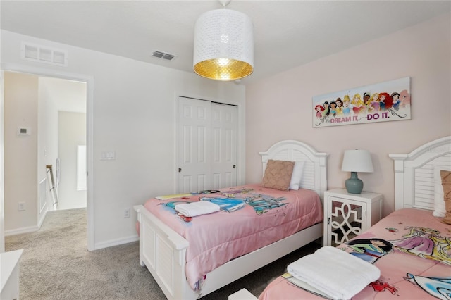 carpeted bedroom with a closet