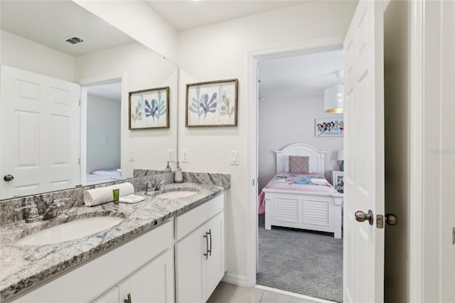 bathroom with vanity and tile patterned flooring