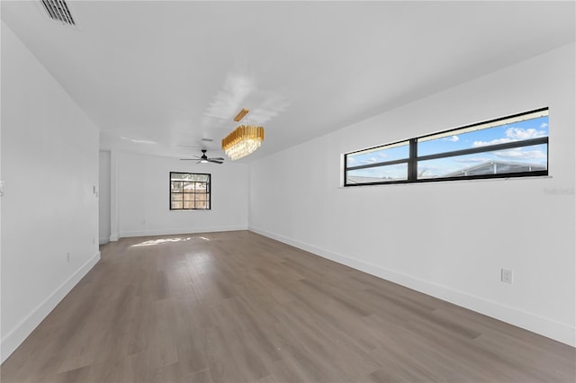 spare room featuring ceiling fan and hardwood / wood-style floors