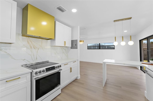 kitchen featuring range with electric cooktop, white cabinetry, decorative backsplash, hanging light fixtures, and light stone countertops