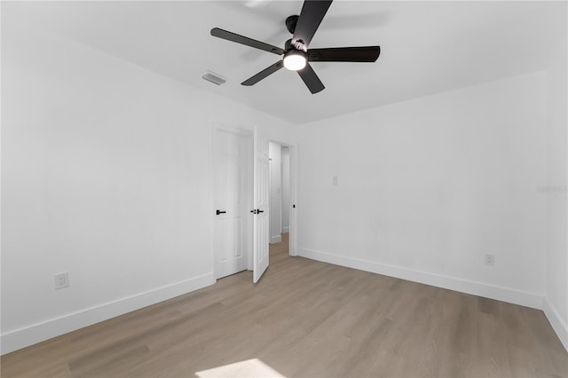 spare room with ceiling fan and light hardwood / wood-style floors