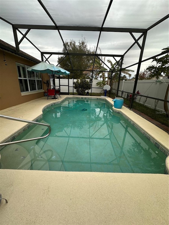 view of pool featuring a patio and a lanai