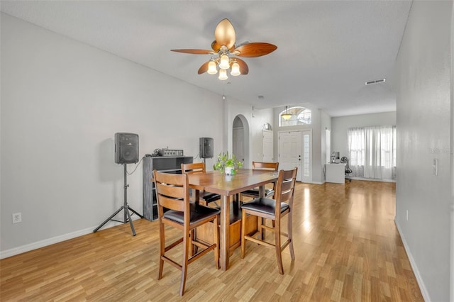 dining area featuring ceiling fan and light hardwood / wood-style flooring