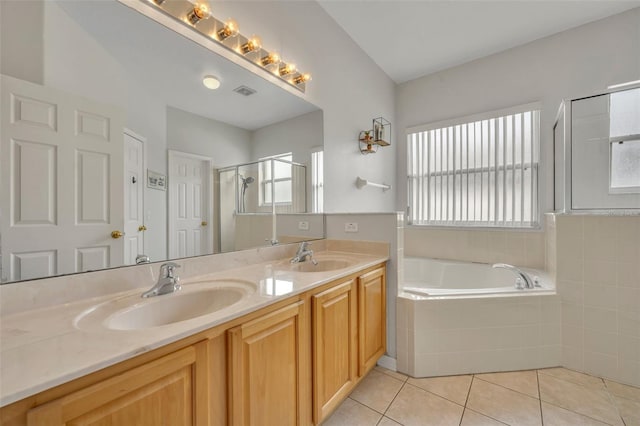 bathroom featuring tile patterned floors, vanity, and independent shower and bath