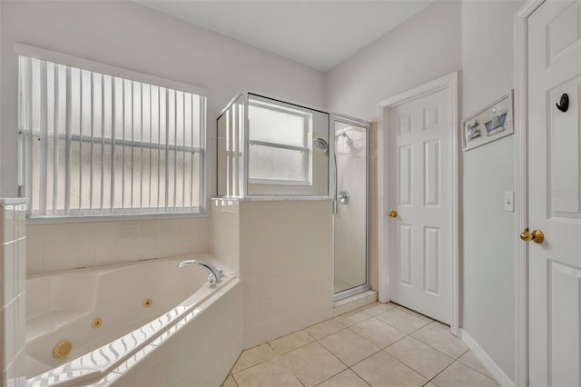 bathroom with plus walk in shower and tile patterned flooring