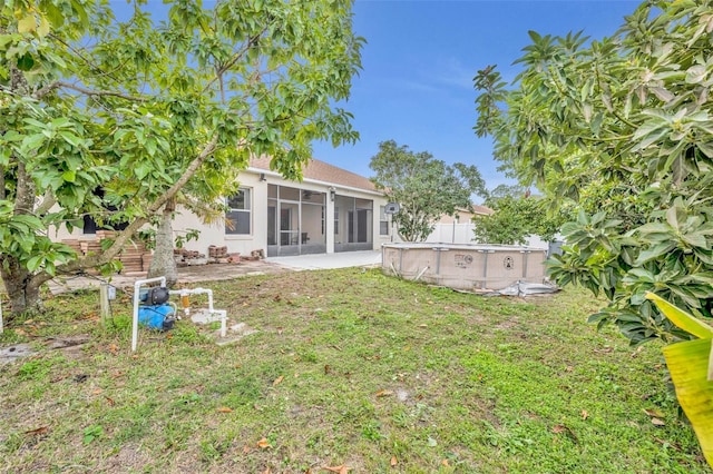 view of yard with a sunroom