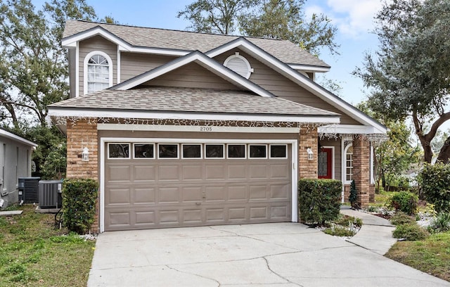 2705 Grantham Ct, Orlando, FL 32835 - view of front facade featuring a garage and central AC