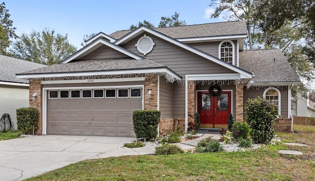 view of front of property with a garage and a front yard