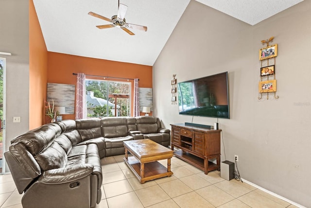 tiled living room with lofted ceiling and ceiling fan