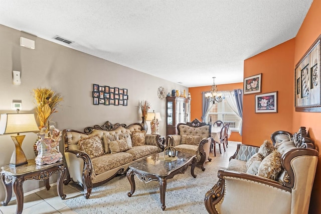 tiled living room with a notable chandelier and a textured ceiling