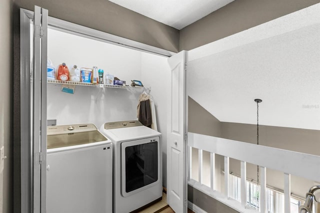 washroom featuring independent washer and dryer