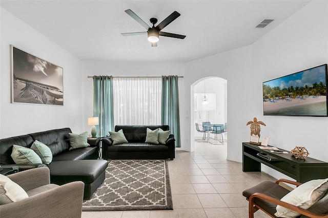 living room with ceiling fan and light tile patterned floors