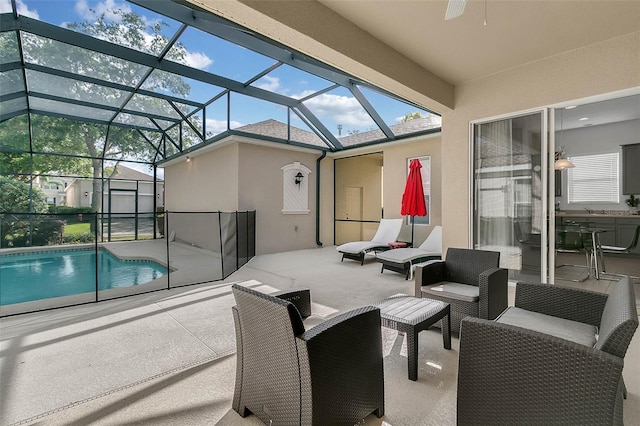 view of patio featuring an outdoor hangout area and glass enclosure