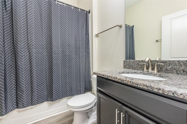 bathroom featuring vanity, toilet, walk in shower, and wood-type flooring