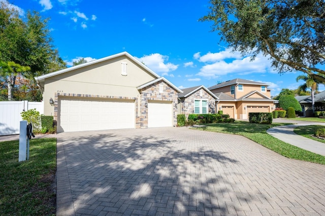 view of front of house featuring a garage and a front yard