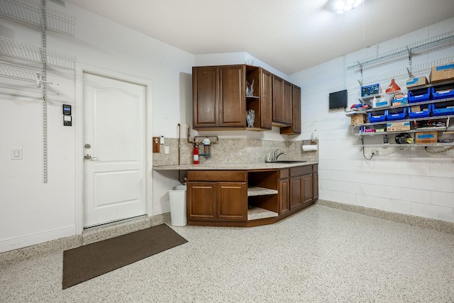 kitchen featuring tasteful backsplash and sink