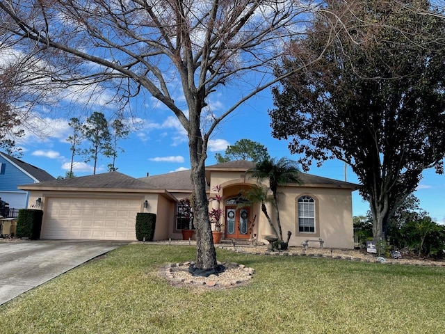 single story home featuring a garage and a front yard