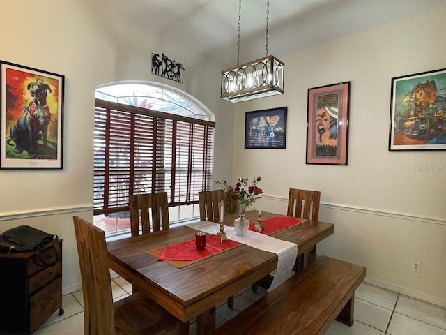 dining room with light tile patterned floors and a wealth of natural light