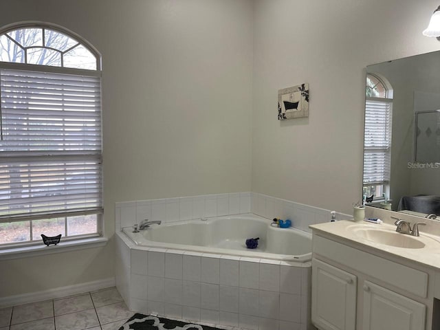 bathroom with vanity, tile patterned floors, and plus walk in shower