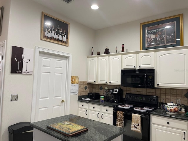 kitchen featuring tasteful backsplash, white cabinetry, and black appliances