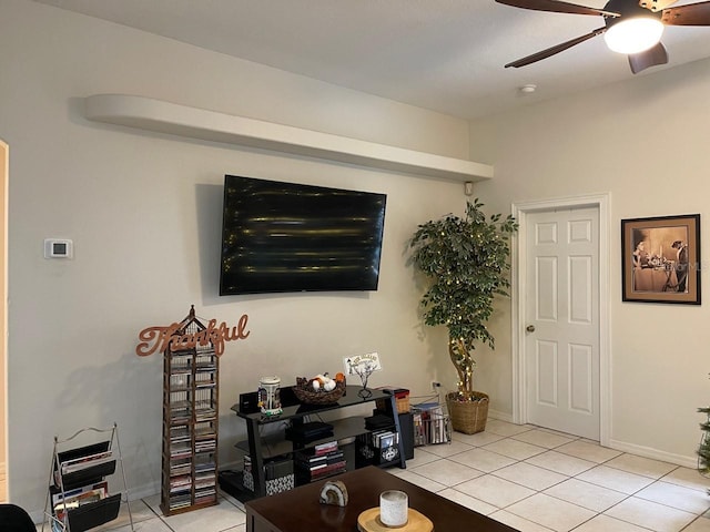 tiled living room with ceiling fan