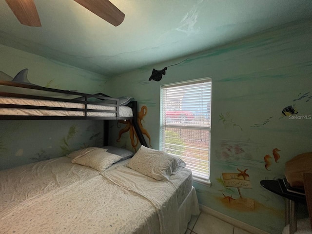 tiled bedroom with ceiling fan