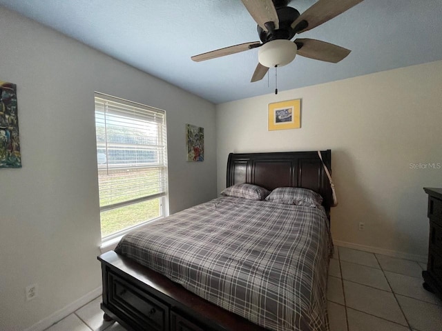 bedroom with light tile patterned floors and ceiling fan