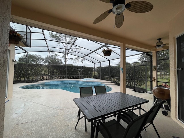 view of swimming pool featuring grilling area, a patio area, ceiling fan, and glass enclosure