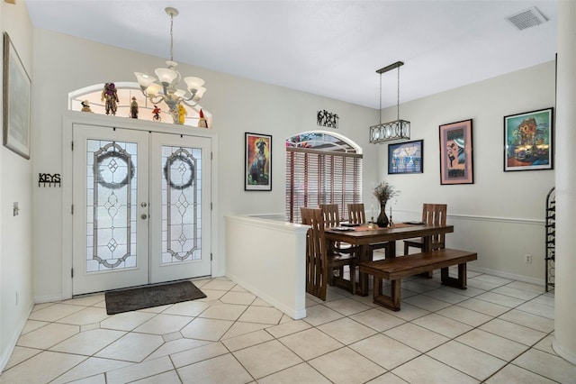 14101 Vista Del Lago Blvd, Clermont, FL 34711 - foyer entrance featuring baseboards, an inviting chandelier, light tile patterned floors, and visible vents