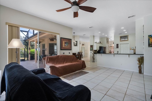 14101 Vista Del Lago Blvd, Clermont, FL 34711 - living area featuring ceiling fan, recessed lighting, baseboards, light tile patterned floors, and visible vents