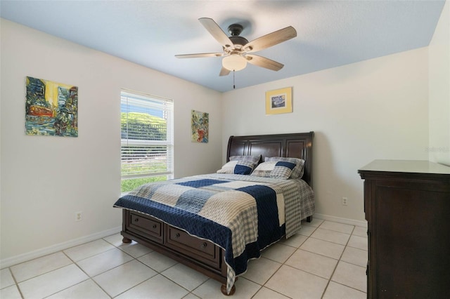 14101 Vista Del Lago Blvd, Clermont, FL 34711 - bedroom with baseboards, a ceiling fan, and light tile patterned floors