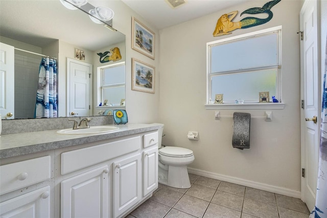14101 Vista Del Lago Blvd, Clermont, FL 34711 - bathroom featuring visible vents, tile patterned flooring, baseboards, vanity, and toilet