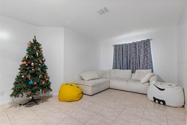 living room with light tile patterned floors