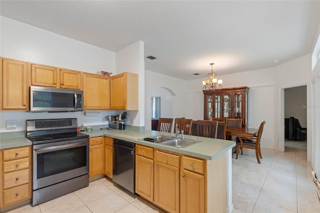 kitchen featuring a chandelier, light tile patterned floors, sink, kitchen peninsula, and stainless steel appliances