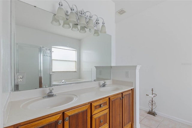 bathroom featuring tile patterned floors, vanity, and shower with separate bathtub