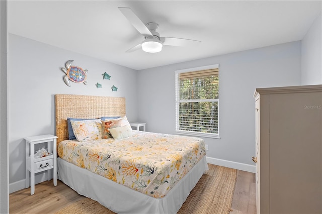 bedroom featuring light hardwood / wood-style flooring and ceiling fan