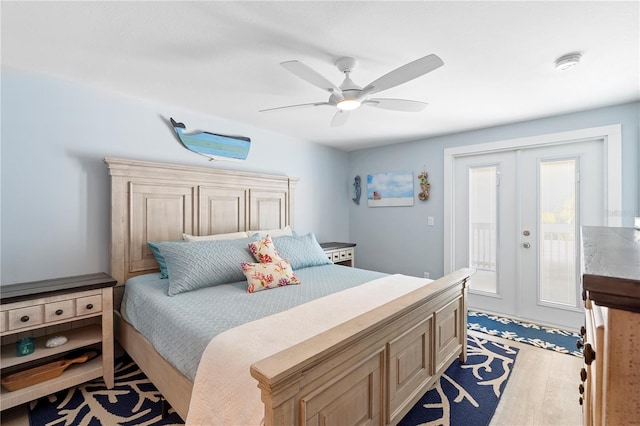 bedroom with access to exterior, french doors, ceiling fan, and light wood-type flooring