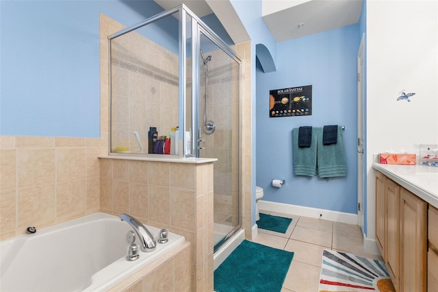 full bathroom with tile patterned floors, vanity, toilet, and plus walk in shower