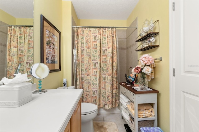 full bathroom featuring a textured ceiling, tile patterned floors, vanity, and toilet