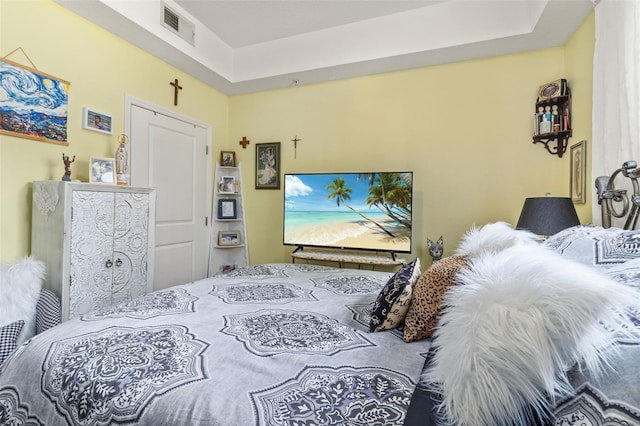 bedroom with a raised ceiling