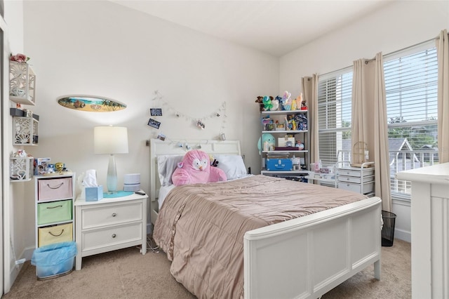 bedroom featuring light carpet