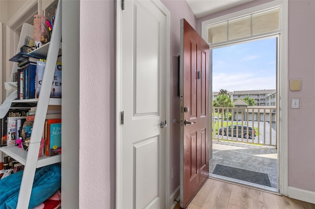 doorway to outside with wood finished floors